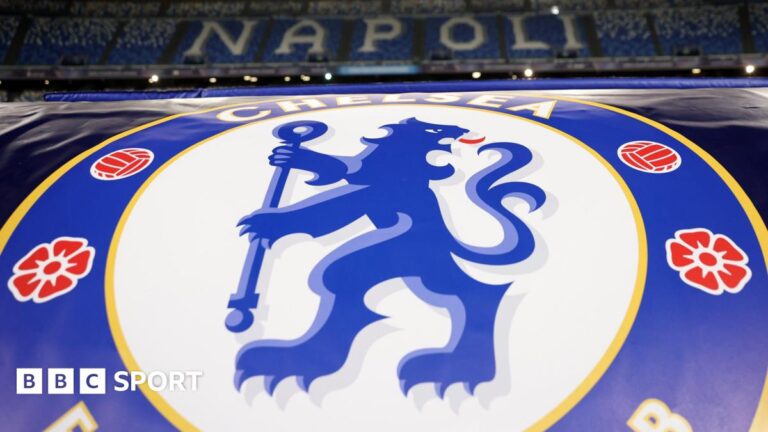 A view of the stands of Napoli's Diego Armando Maradona Stadium, with the Chelsea badge in the foreground