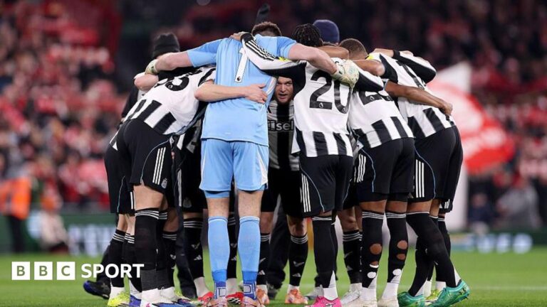 Newcastle United players gather in a huddle before the game against Liverpool at Anfield on 31 January